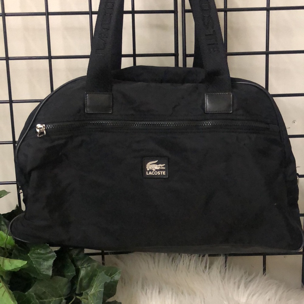 Lacoste duffle bag black color clean measurements are 18” wide 11” high